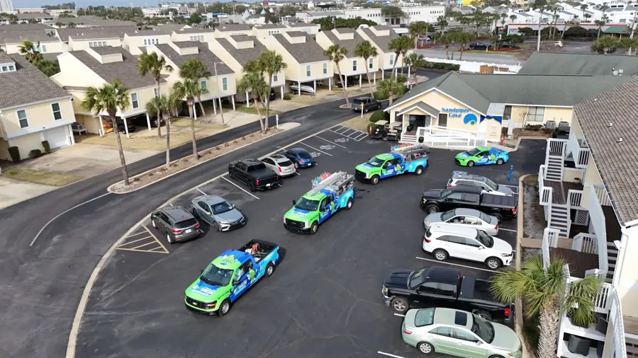 Eco Green Softwash trucks at a condo complex