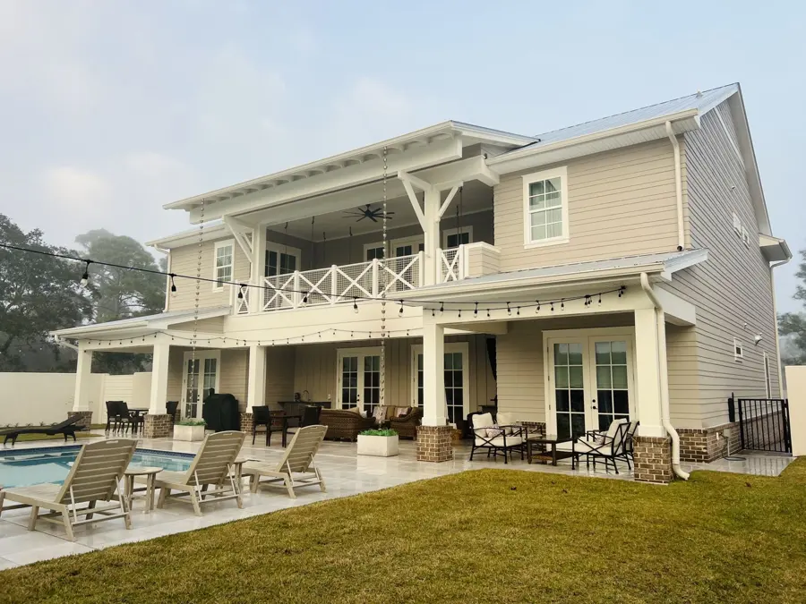Two-story home with a pool deck